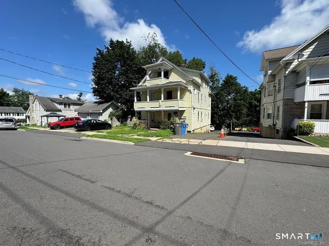 a bedroom with bed and a window
