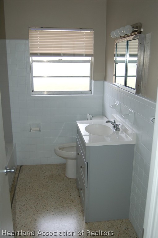 3029 West Verona Road Avon Park, FL 33825 - Photo 19 of 25 a bathroom with a sink a toilet and window
