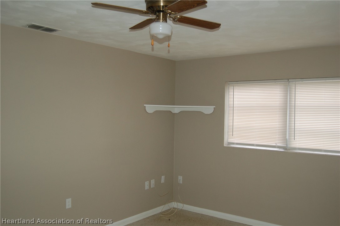 3029 West Verona Road Avon Park, FL 33825 - Photo 22 of 25 a view of a room with a window and a fan
