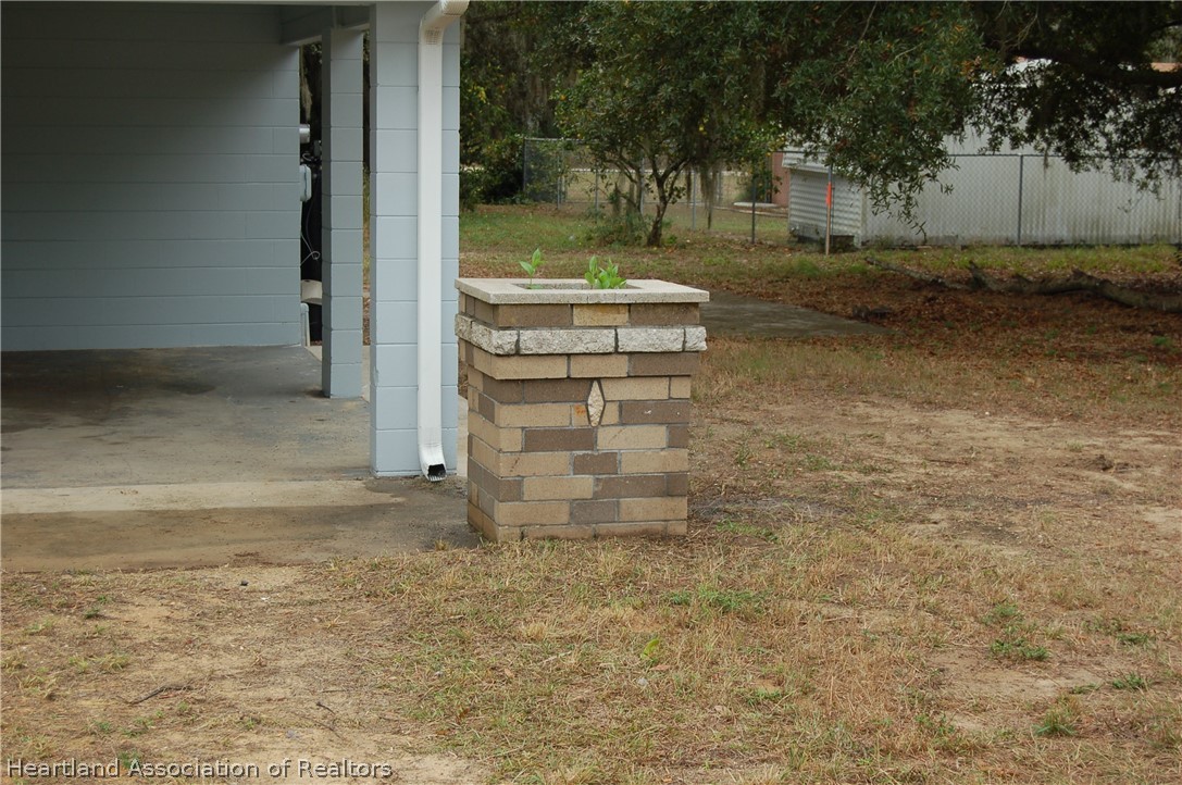 3029 West Verona Road Avon Park, FL 33825 - Photo 5 of 25 a backyard of a house with barbeque oven