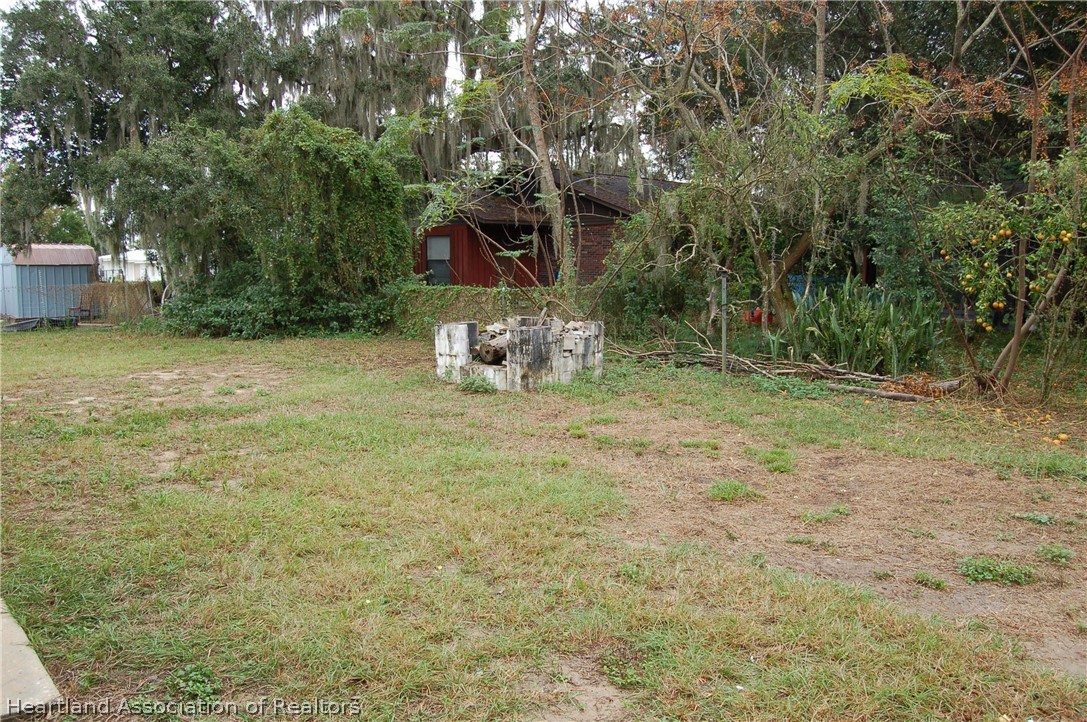 3029 West Verona Road Avon Park, FL 33825 - Photo 7 of 25 a backyard of a house with table and chairs