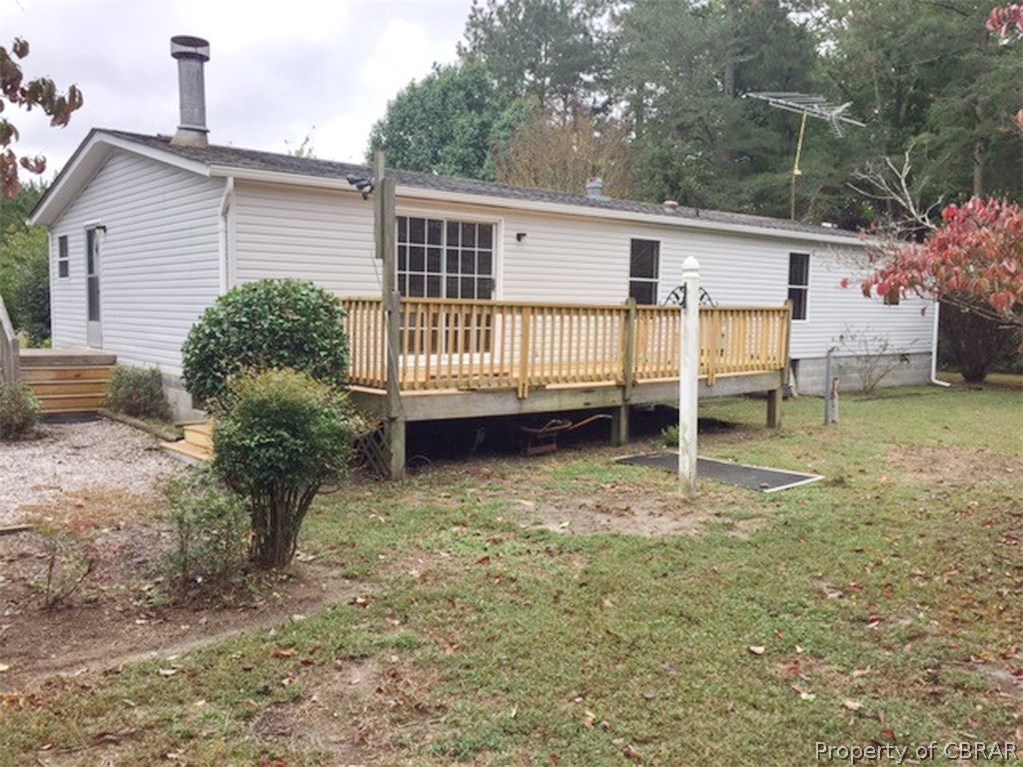 Nice rear deck on back of home to enjoy your spacious back yard.