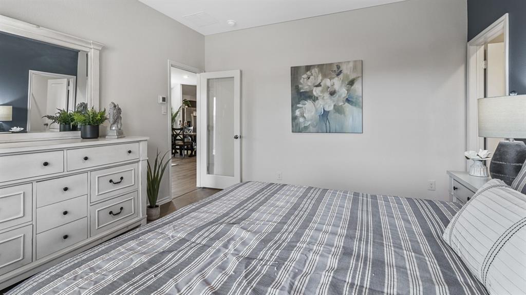 1667 Mantle Road Crandall, TX 75114 - Photo 16 of 20 Bedroom with light gray walls and a contrasting accent wall