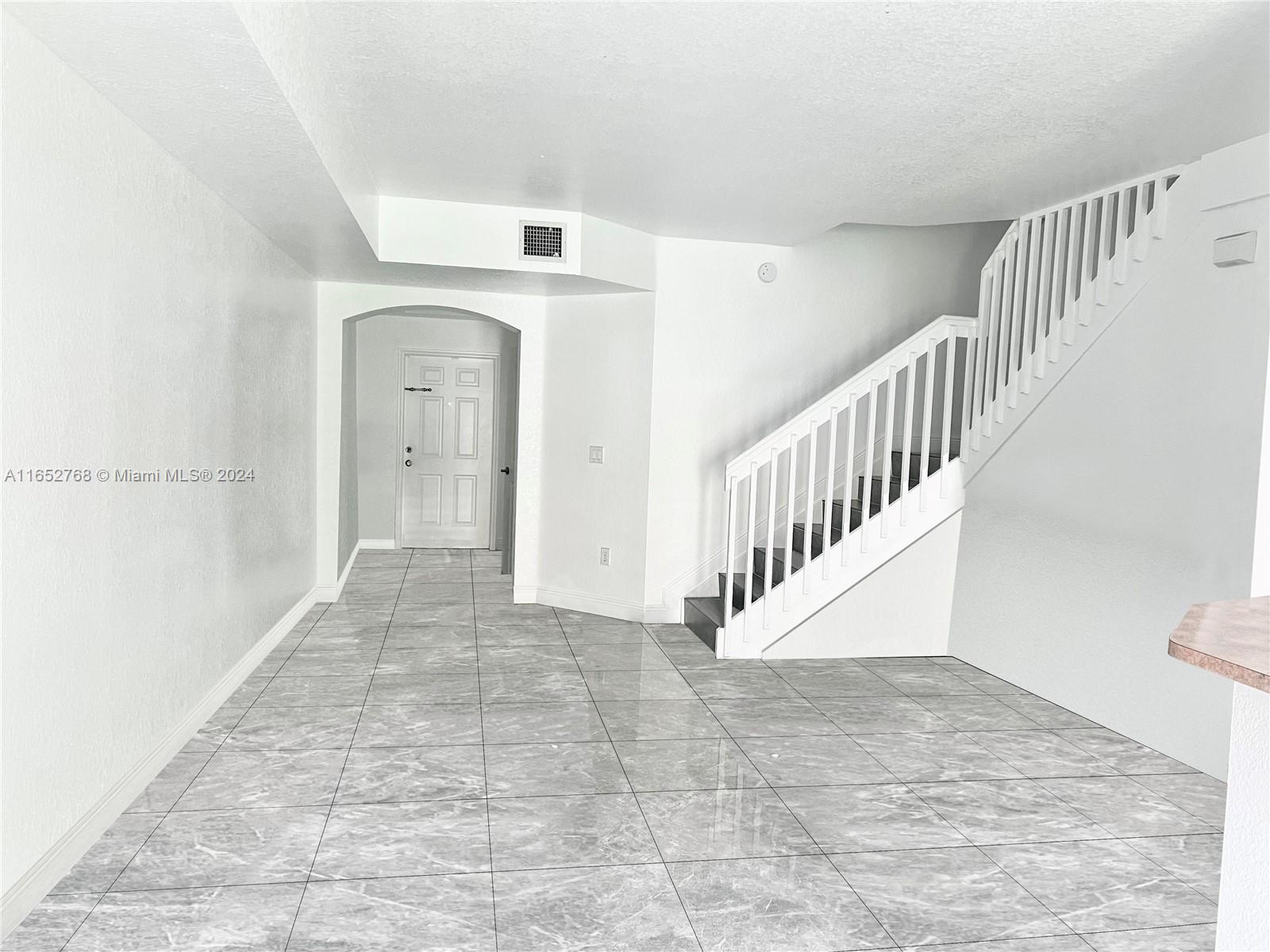 8924 West Flagler Street, Unit 2 Miami, FL 33174 - Photo 2 of 7 a view of an entryway with staircase