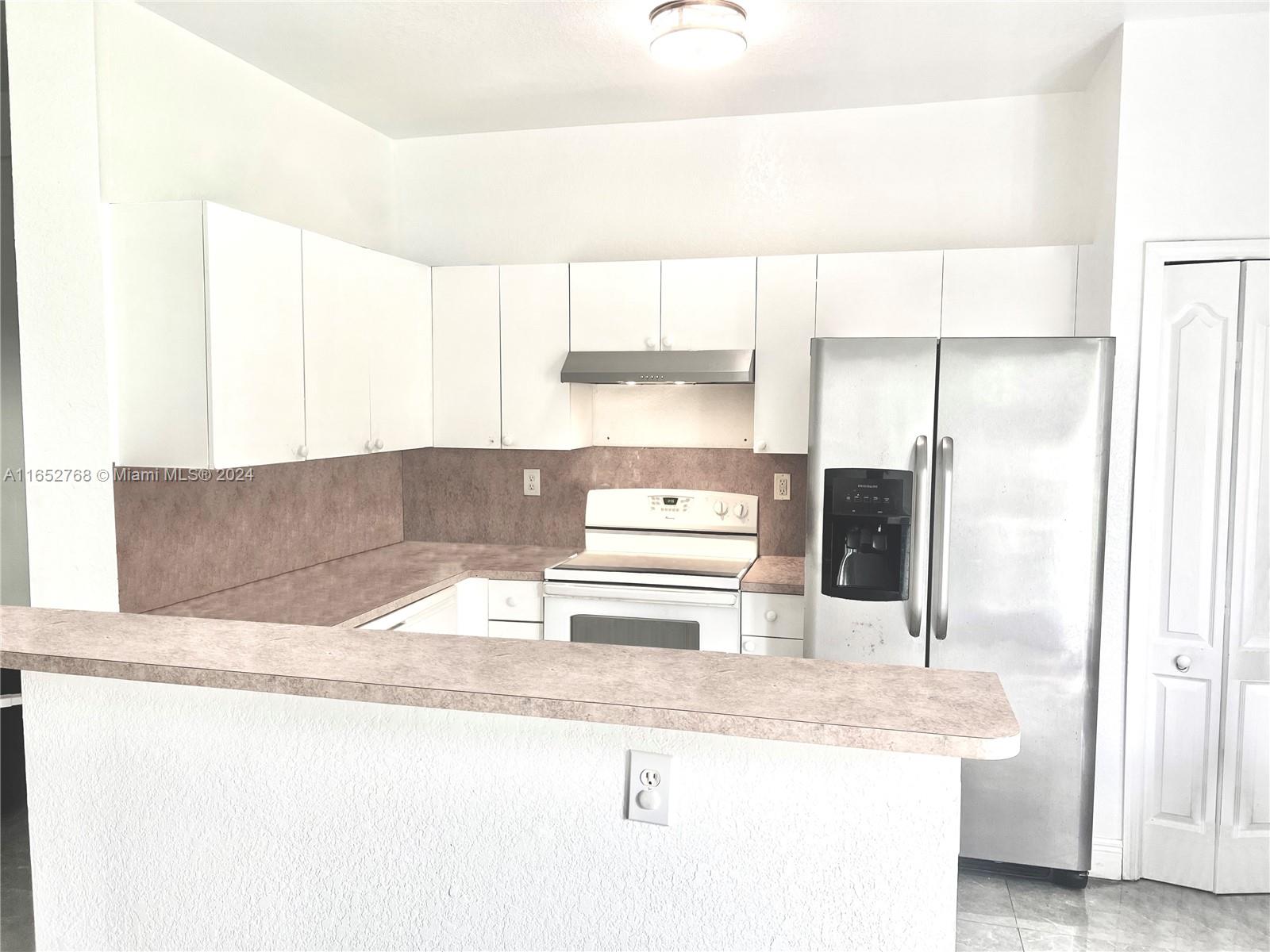 8924 West Flagler Street, Unit 2 Miami, FL 33174 - Photo 7 of 7 a bathroom with a granite countertop sink and a mirror