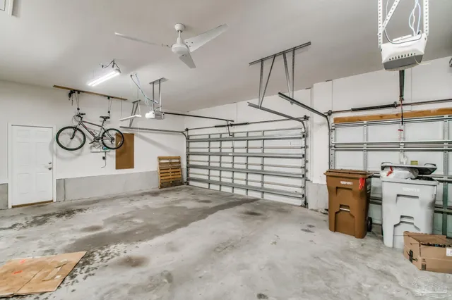 a view of a garage with parked cars