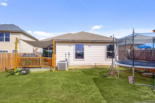 a house view with a backyard space
