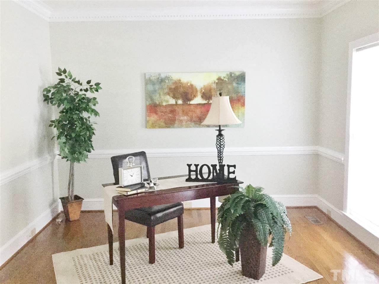 11604 Chipaway Court Raleigh, NC 27614 - Photo 11 of 25 a living room with furniture and a lamp