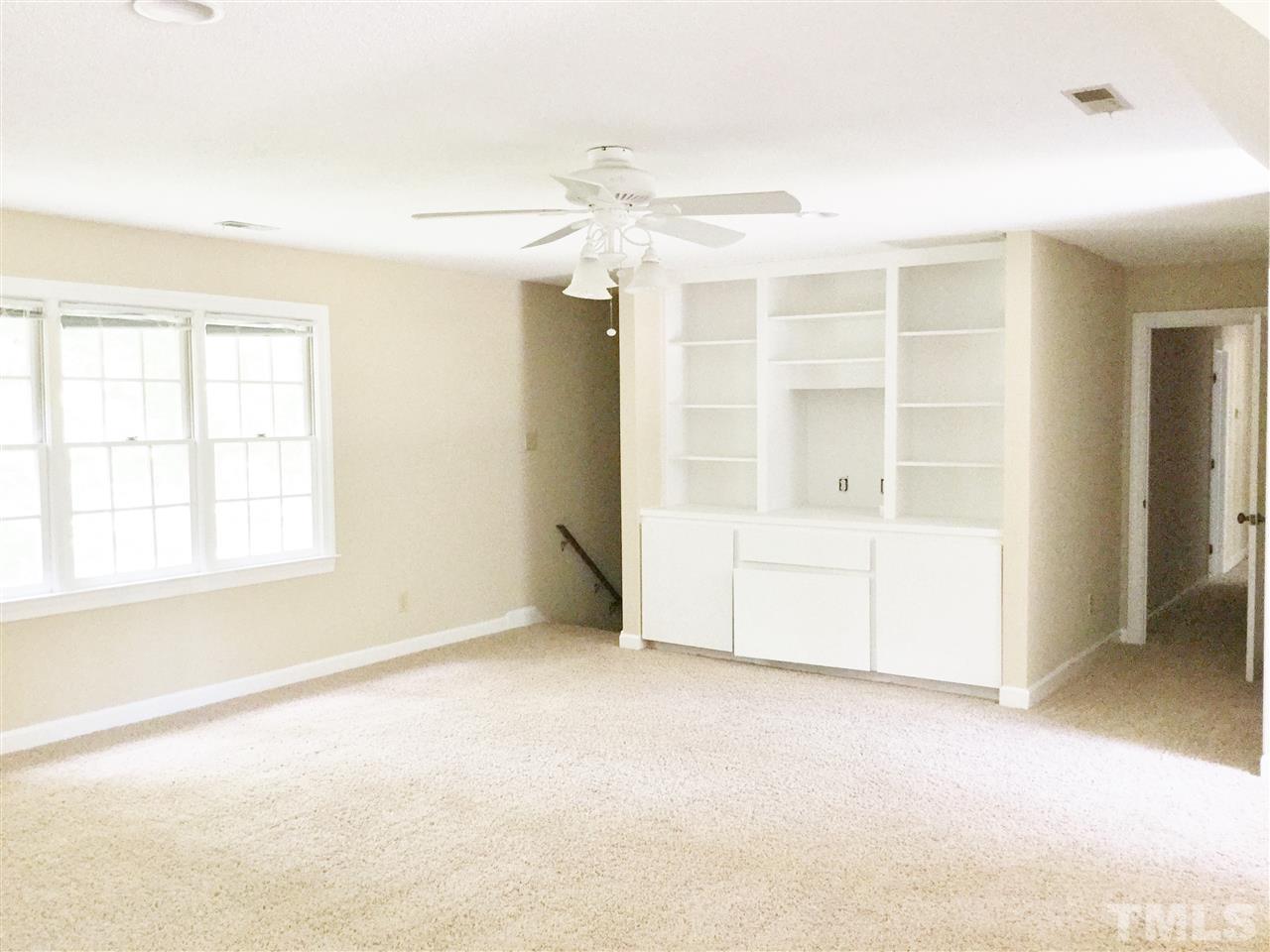 11604 Chipaway Court Raleigh, NC 27614 - Photo 16 of 25 an empty room with a empty space and windows
