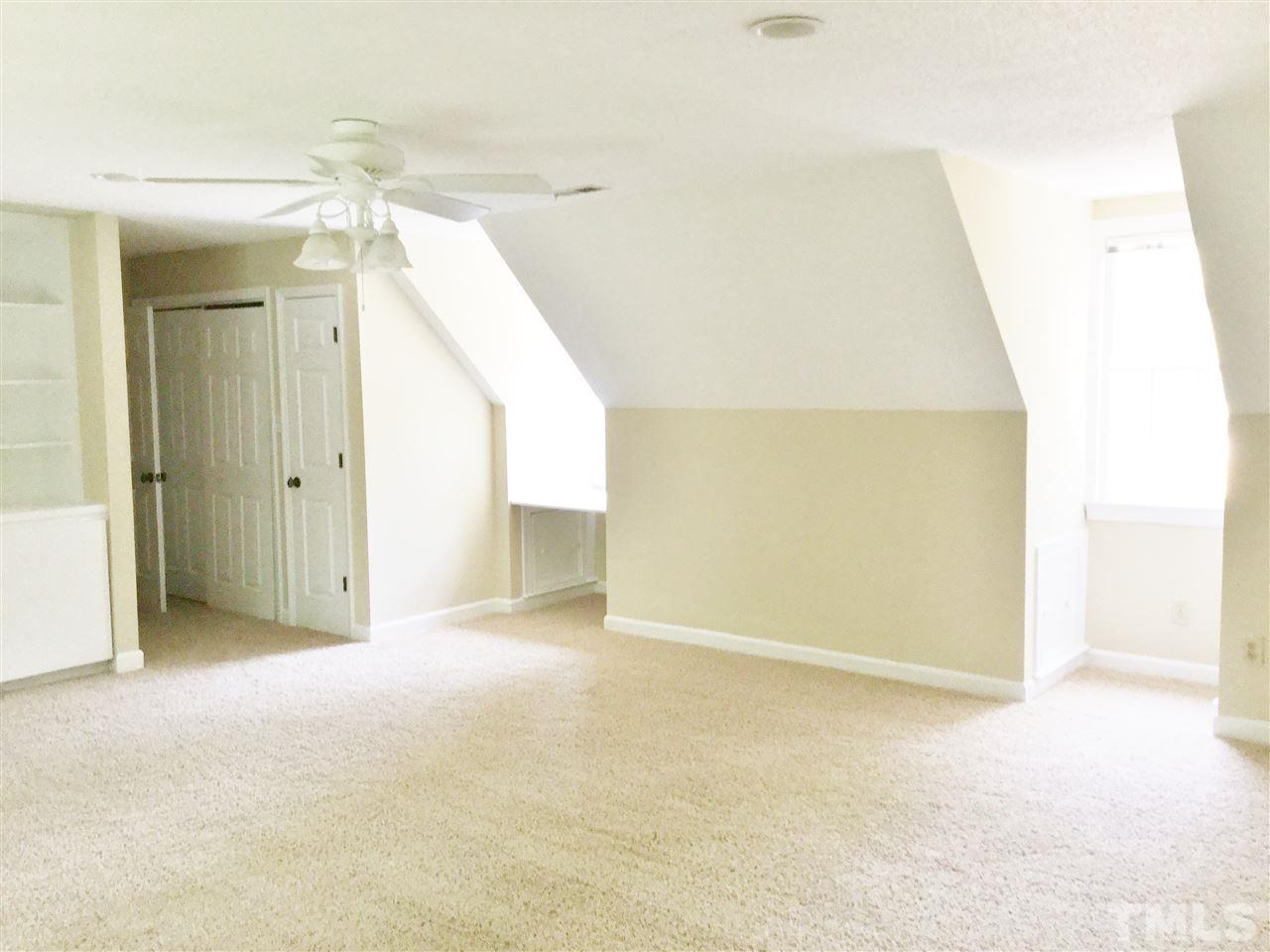 11604 Chipaway Court Raleigh, NC 27614 - Photo 17 of 25 a view of a big room with closet and windows