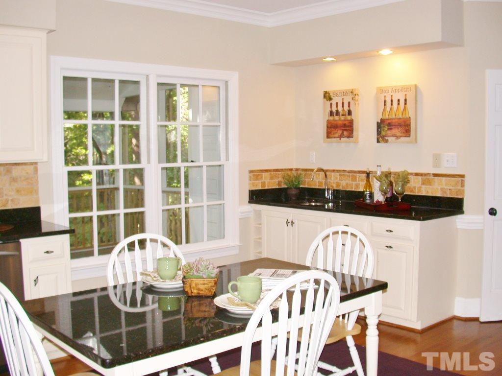 11604 Chipaway Court Raleigh, NC 27614 - Photo 5 of 25 a view of a dining room with furniture and wooden floor