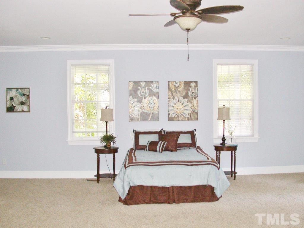 11604 Chipaway Court Raleigh, NC 27614 - Photo 6 of 25 a bedroom with a bed and window
