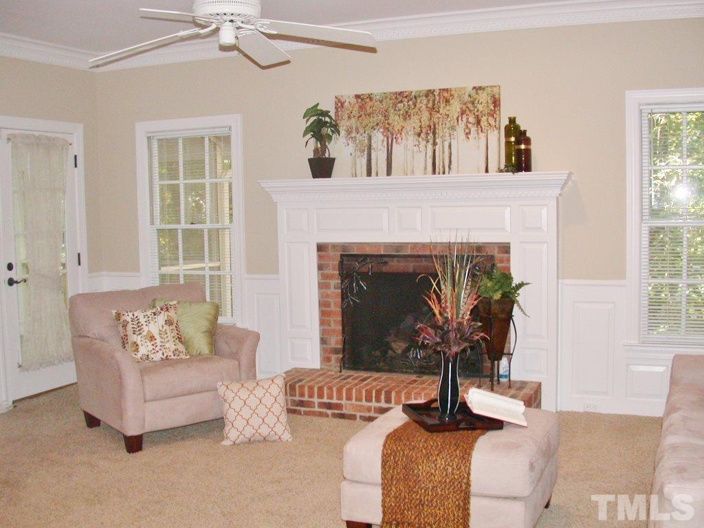 11604 Chipaway Court Raleigh, NC 27614 - Photo 9 of 25 a living room with furniture and a fireplace