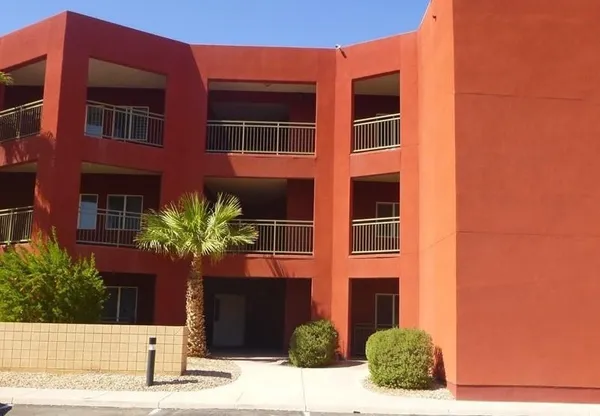 a view of a building with a yard