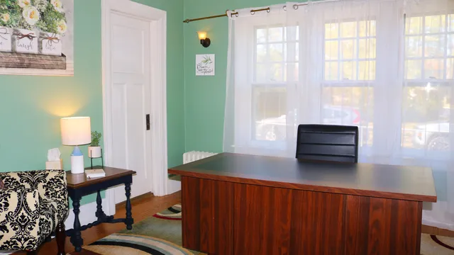 a living room with furniture and a window