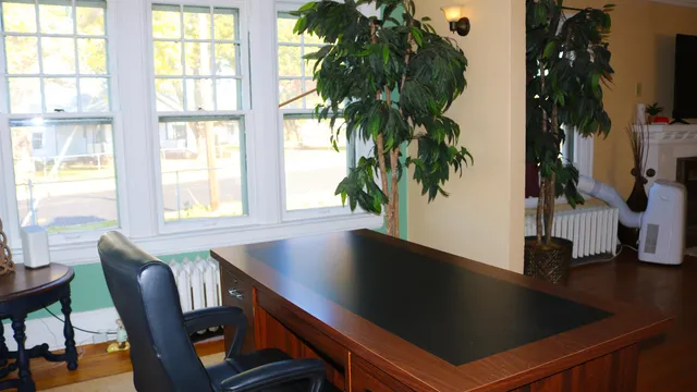 a view of a dining room with furniture and window