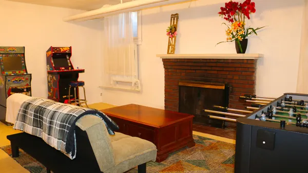 a bedroom with furniture and a fireplace