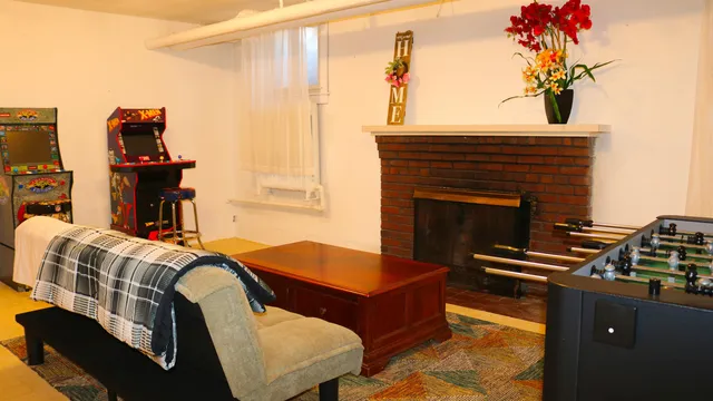 a bedroom with furniture and a fireplace