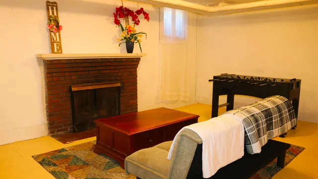 a bedroom with two beds and painted walls