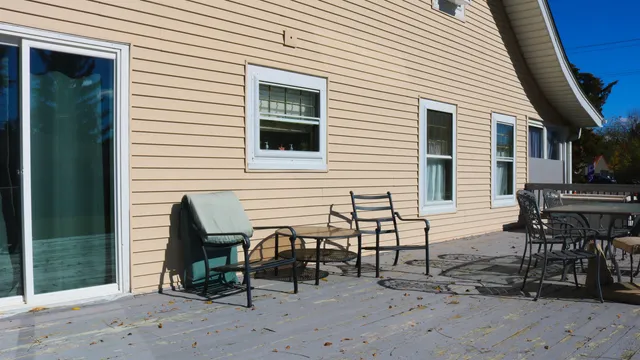 a view of a dinning table and chairs in the patio