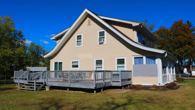 a big house with a big yard and large trees