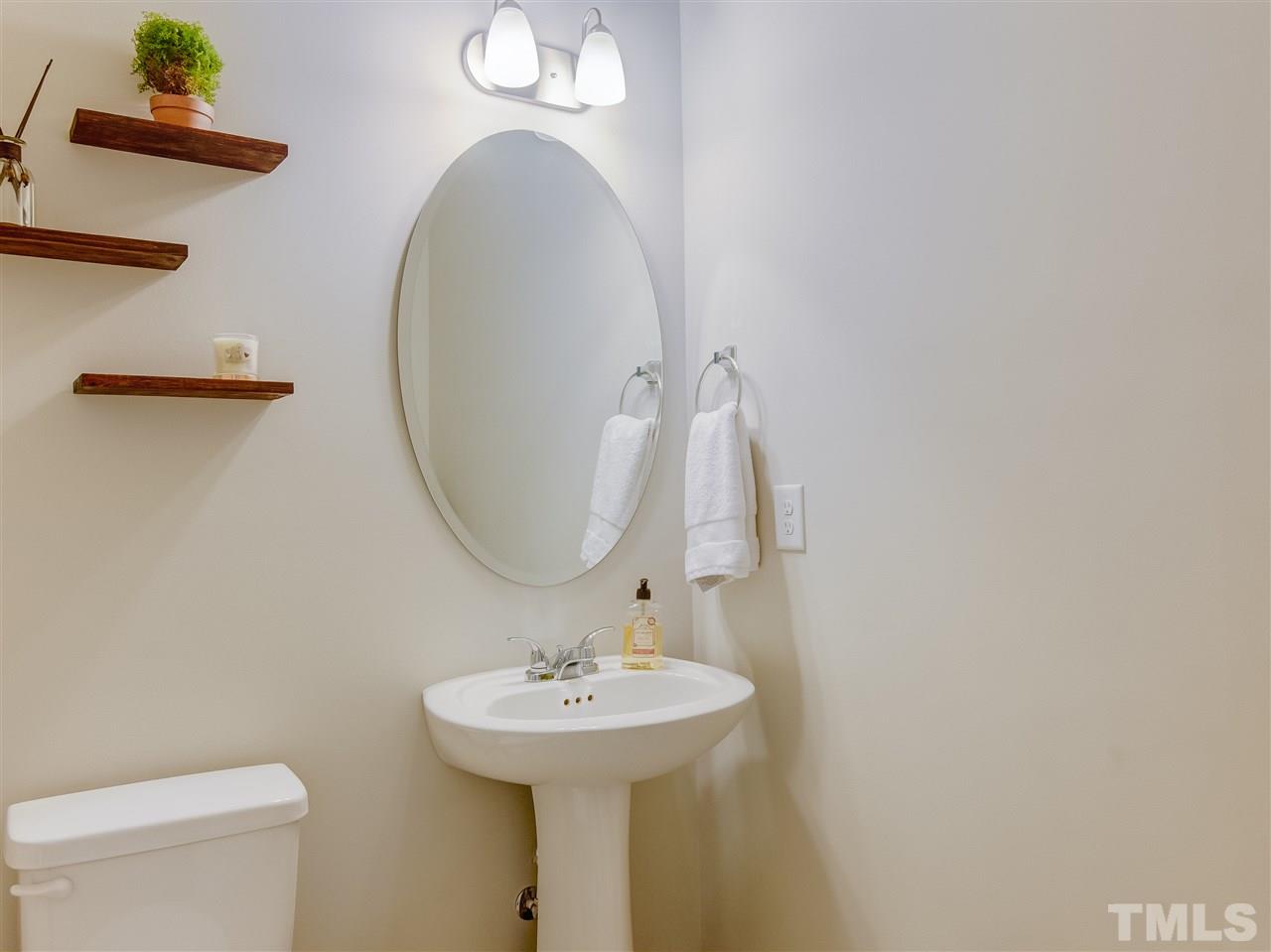 30 Mariners Point Way Garner, NC 27529 - Photo 11 of 25 Powder Room has hardwood floor and pedestal sink.