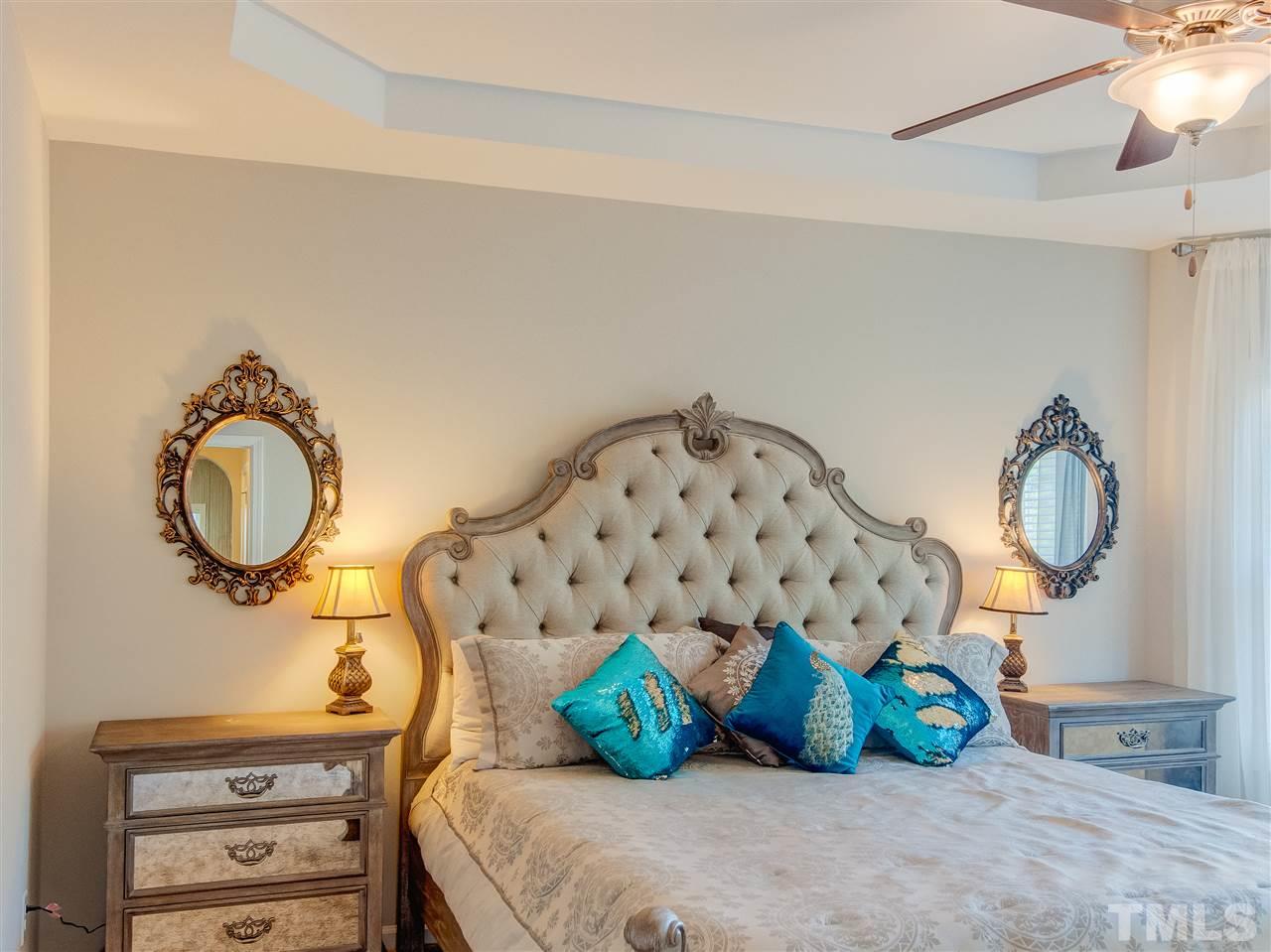 30 Mariners Point Way Garner, NC 27529 - Photo 12 of 25 Luxurious Master Bedroom with walk out bay window, spacious walk in closet, trey ceiling, fan with light and neutral upgraded carpet.