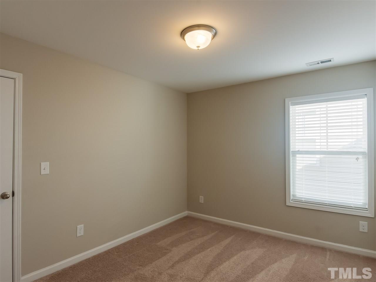 30 Mariners Point Way Garner, NC 27529 - Photo 19 of 25 1st of 3 Secondary bedrooms located on the 2nd floor; has a double closet.