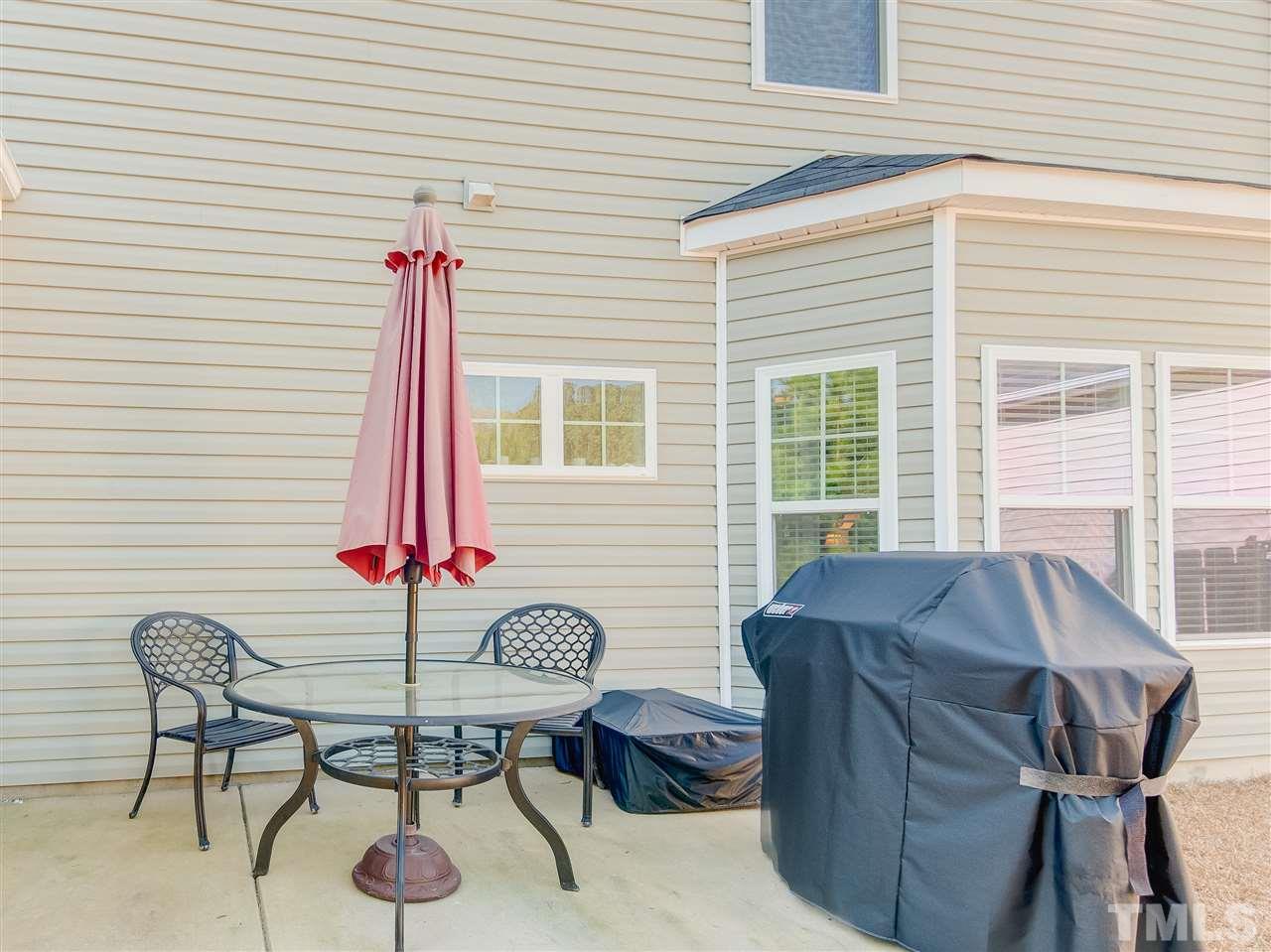 30 Mariners Point Way Garner, NC 27529 - Photo 23 of 25 The patio and screened porch for perfect outdoor entertaining! Overlooks fenced back yard