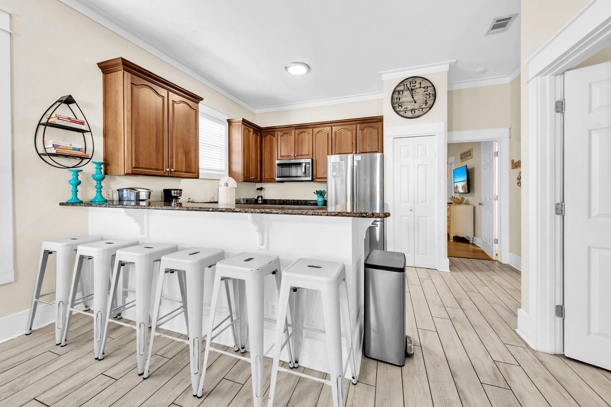 67 Sarasota Street Miramar Beach, FL 32550 - Photo 9 of 61 a kitchen with stainless steel appliances granite countertop a refrigerator and a stove top oven