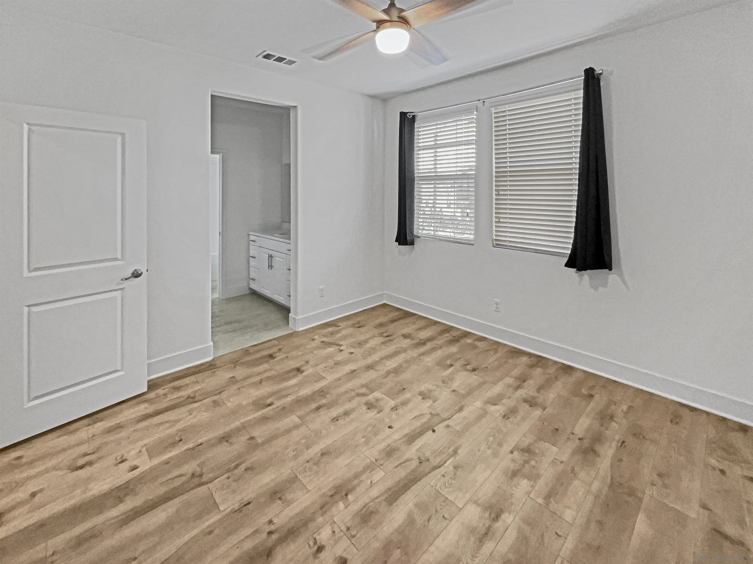 35751 Garrano Lane Fallbrook, CA 92028 - Photo 18 of 28 an empty room with windows and closet