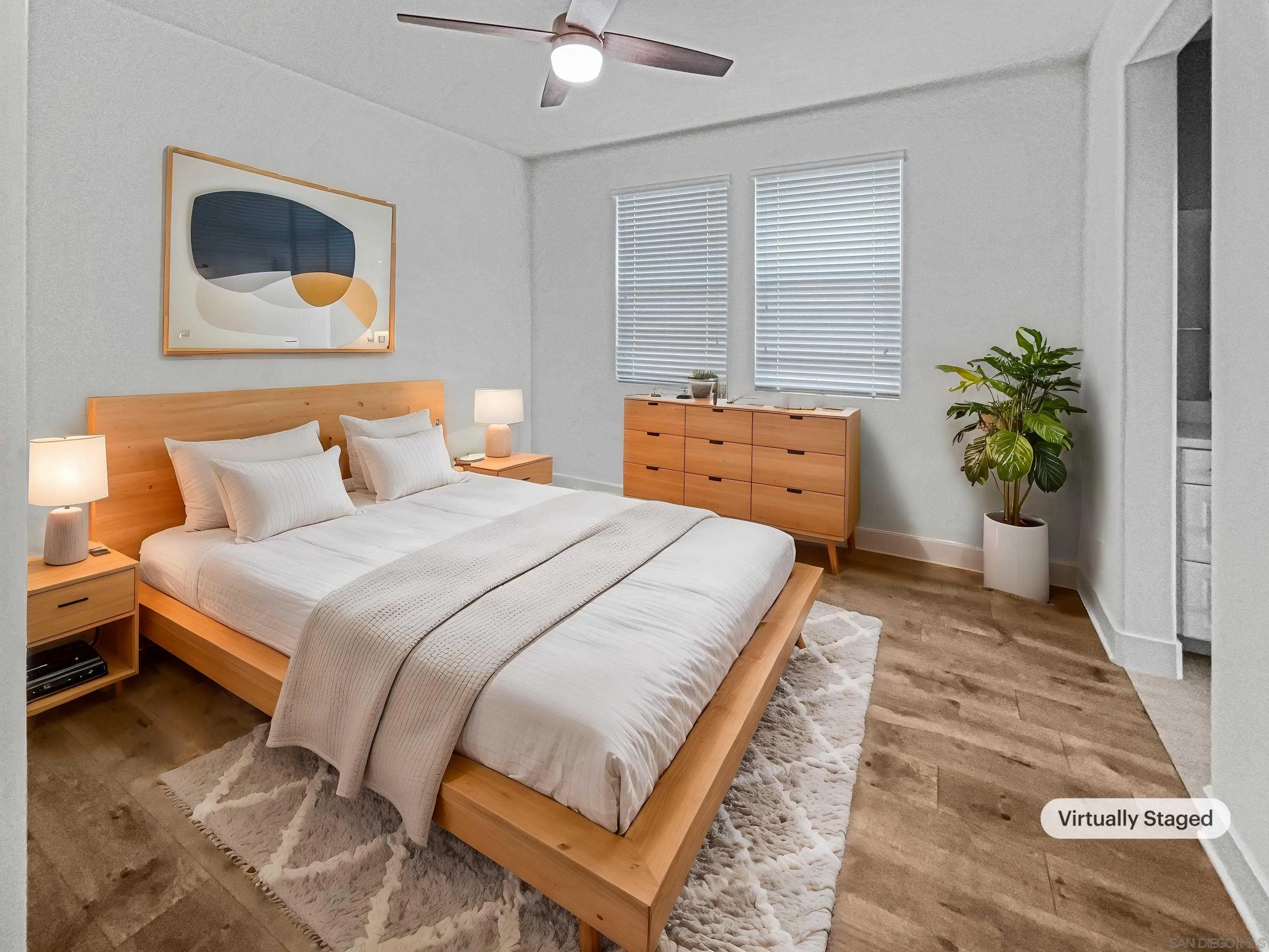 35751 Garrano Lane Fallbrook, CA 92028 - Photo 4 of 28 a bedroom with a bed and a potted plant
