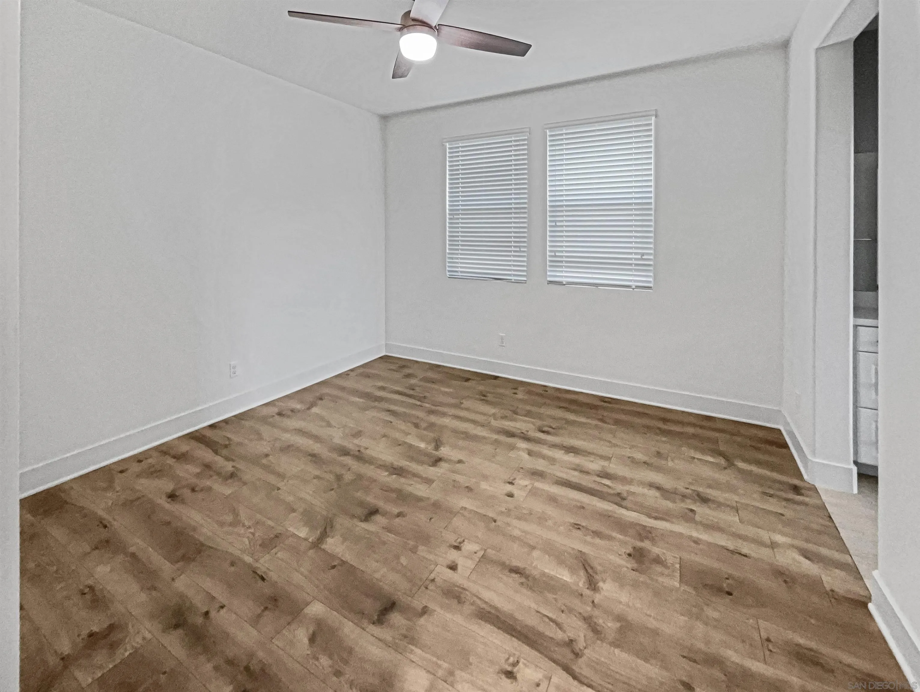 35751 Garrano Lane Fallbrook, CA 92028 - Photo 5 of 28 an empty room with a chandelier fan and window