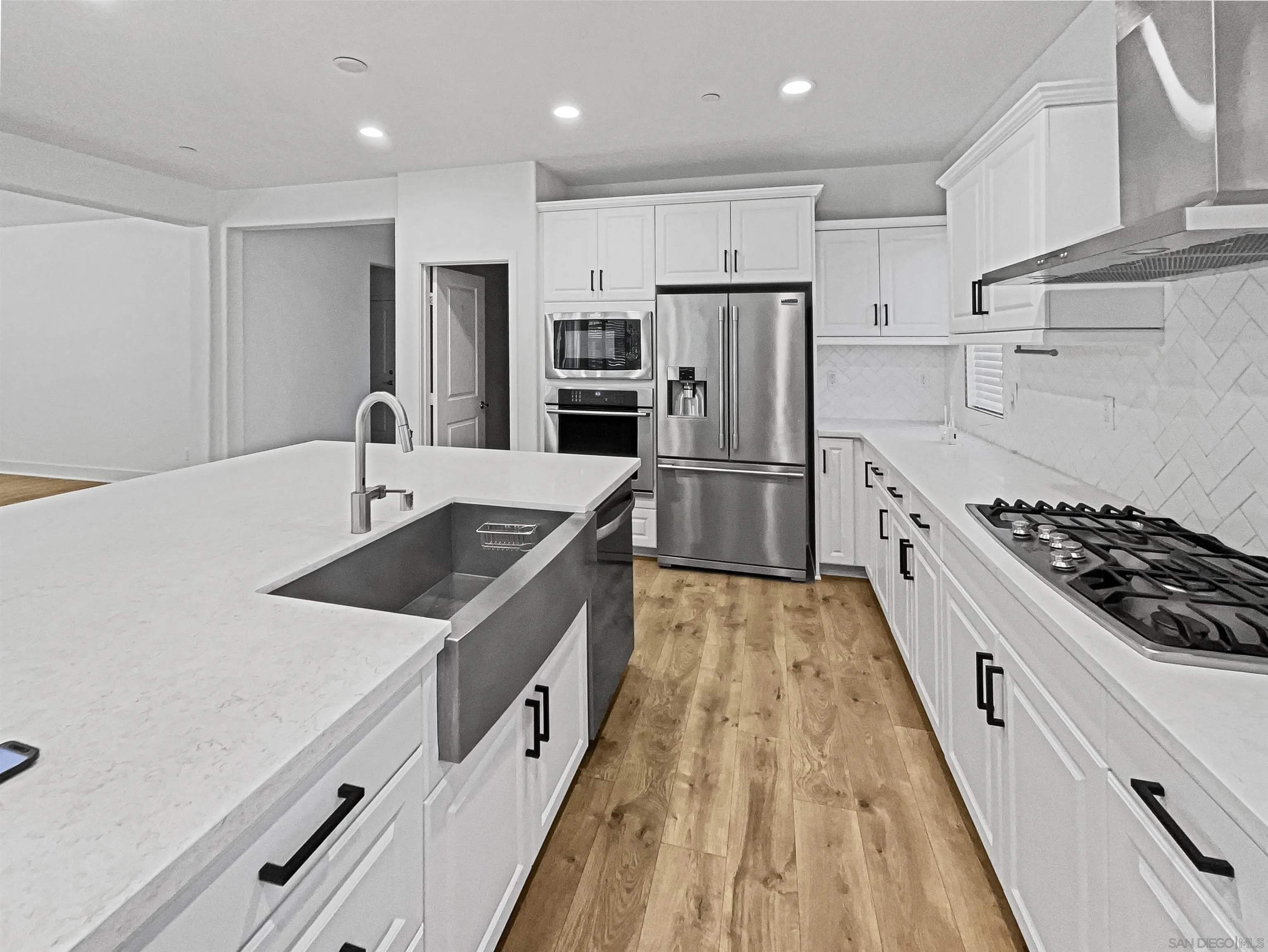 35751 Garrano Lane Fallbrook, CA 92028 - Photo 6 of 28 a kitchen with stainless steel appliances a sink stove and refrigerator