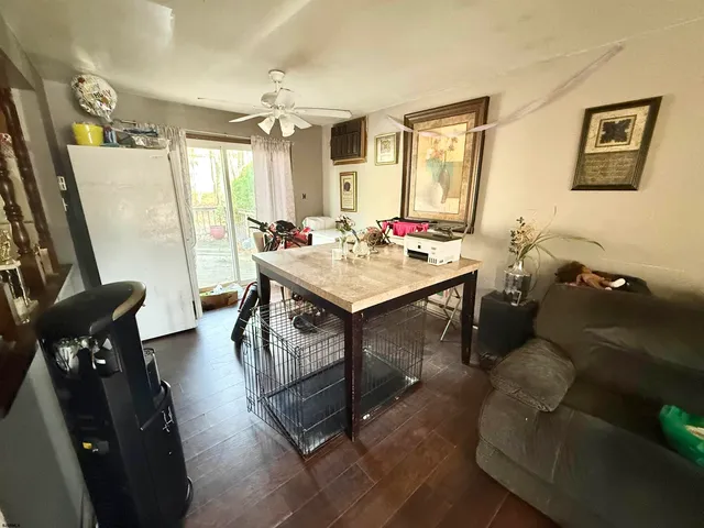 a view of a livingroom with furniture window and wooden floor
