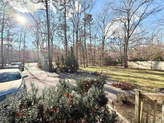 a view of a yard with trees