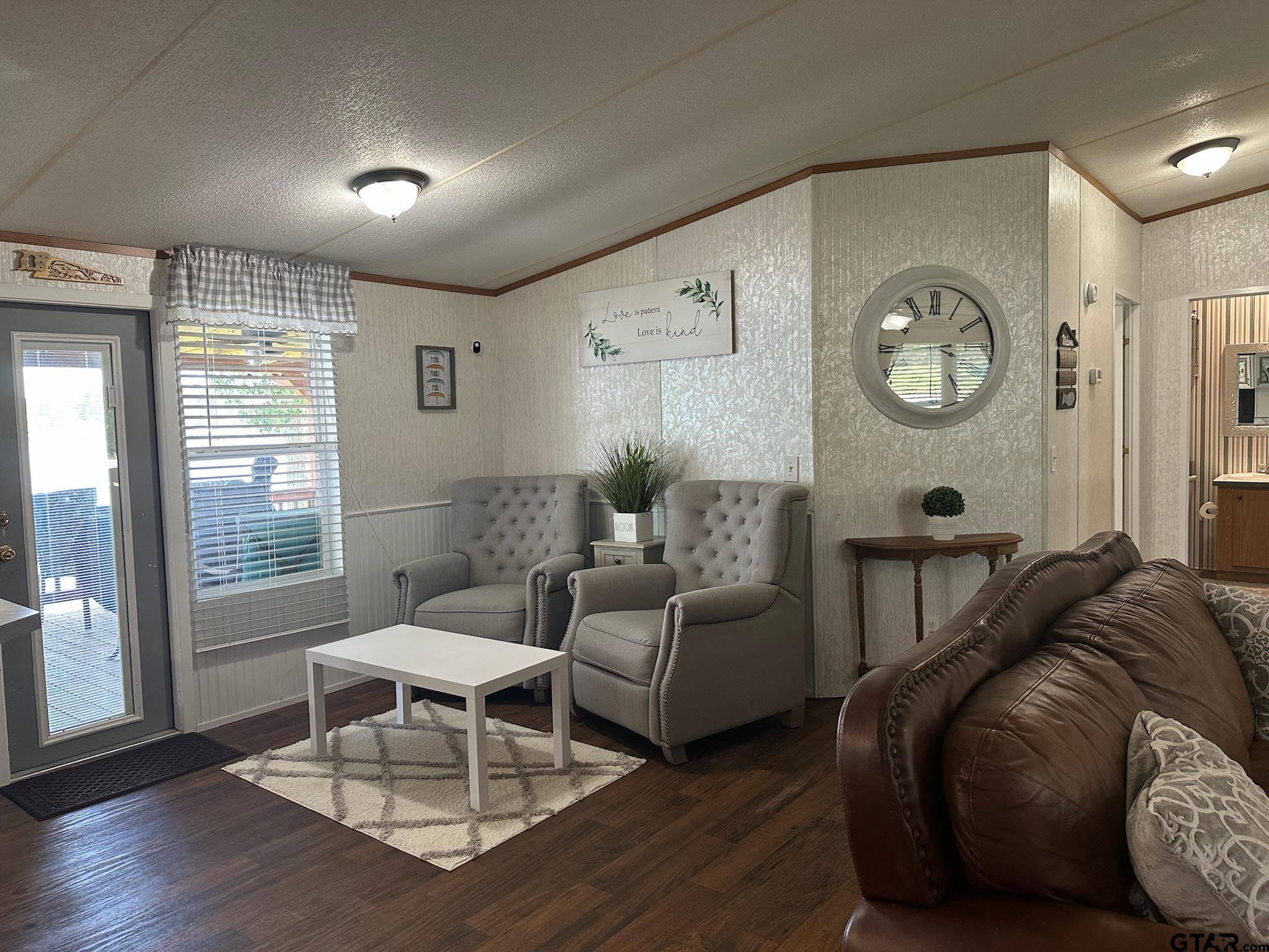 21516 Water Ridge Road Chandler, TX 75758 - Photo 19 of 48 a living room with furniture wooden floor and large window