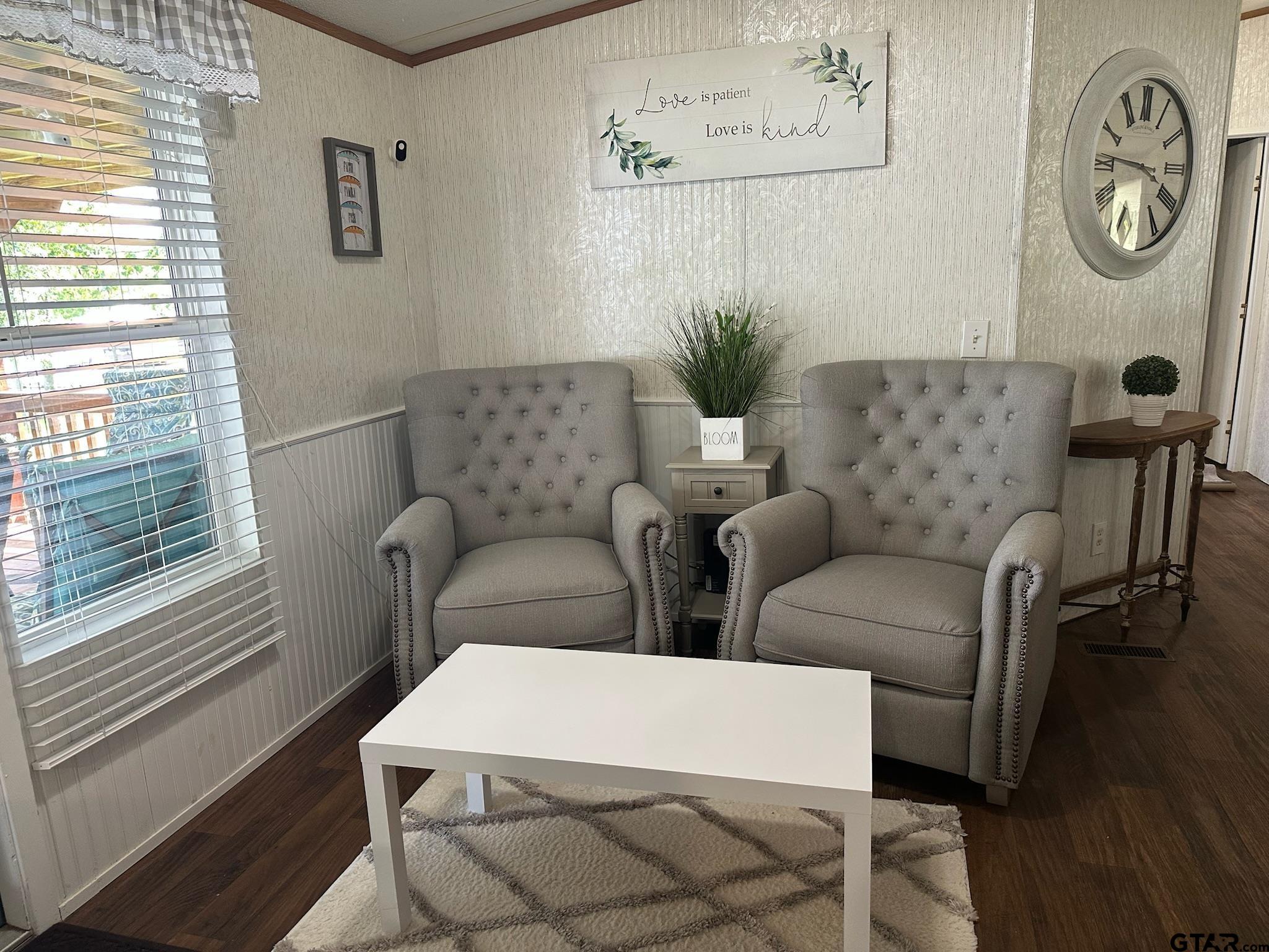 21516 Water Ridge Road Chandler, TX 75758 - Photo 20 of 48 a living room with furniture a rug and a window