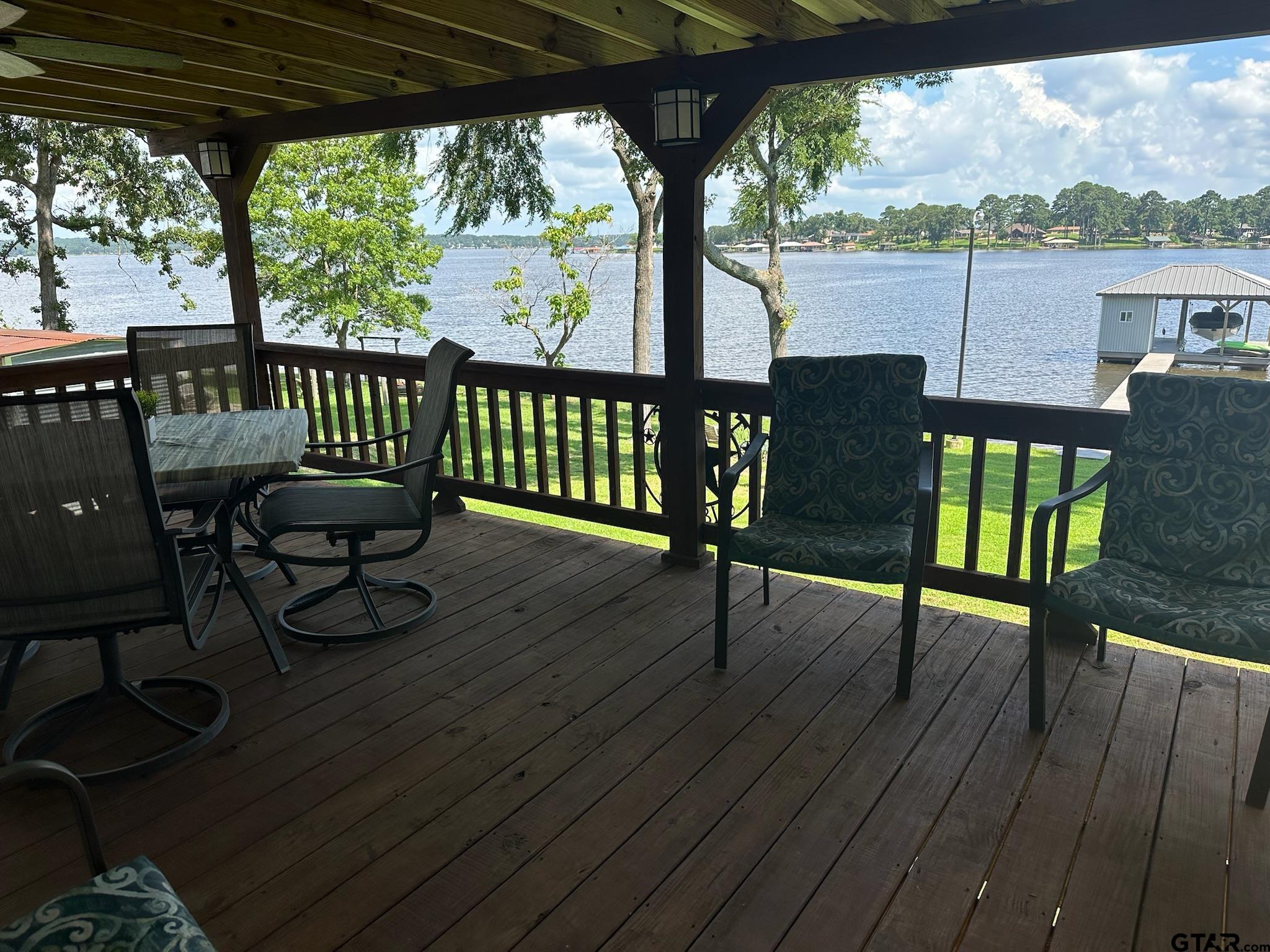 21516 Water Ridge Road Chandler, TX 75758 - Photo 22 of 48 a view of a porch with furniture and wooden floor