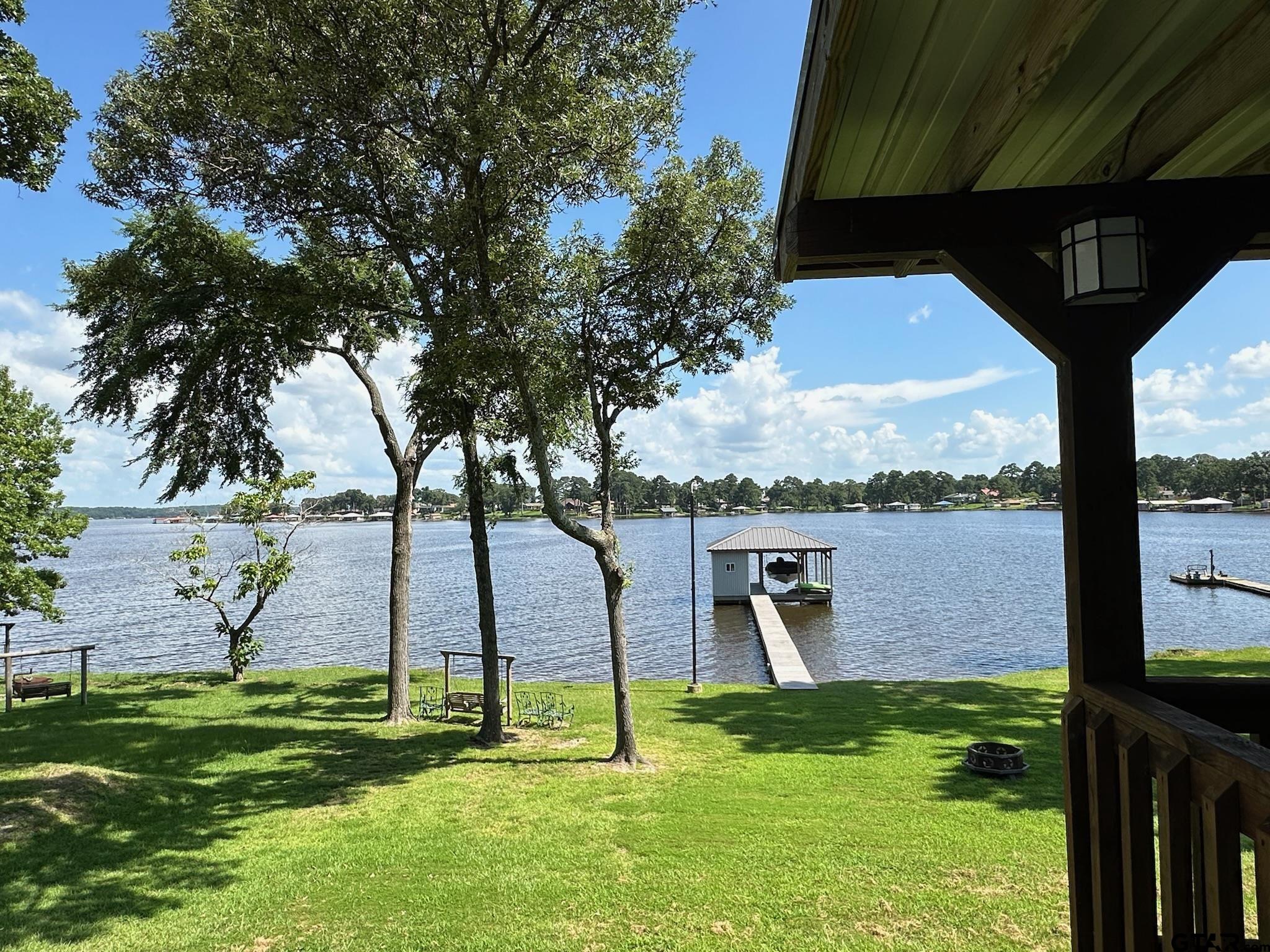 21516 Water Ridge Road Chandler, TX 75758 - Photo 24 of 48 a backyard of a house with lots of green space