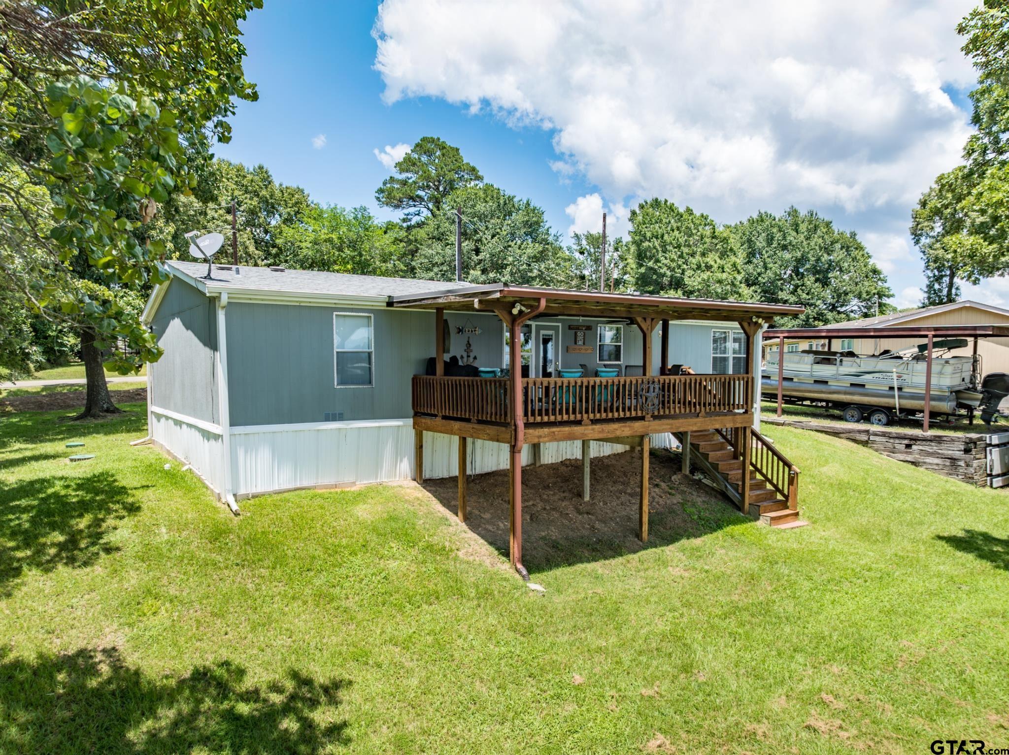 21516 Water Ridge Road Chandler, TX 75758 - Photo 26 of 48 a view of a house with pool and sitting area