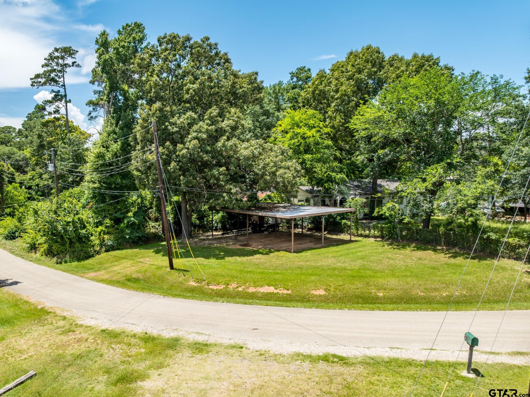 21516 Water Ridge Road Chandler, TX 75758 - Photo 29 of 48 a view of a swimming pool with an outdoor space