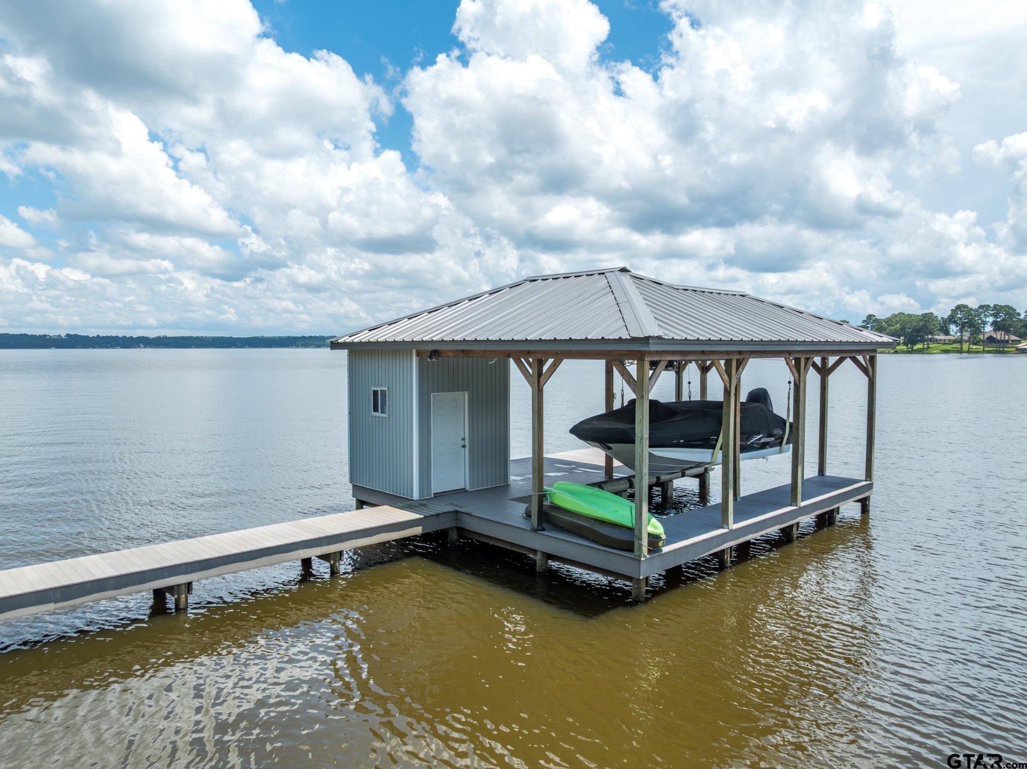 21516 Water Ridge Road Chandler, TX 75758 - Photo 32 of 48 a small pool with lawn chairs