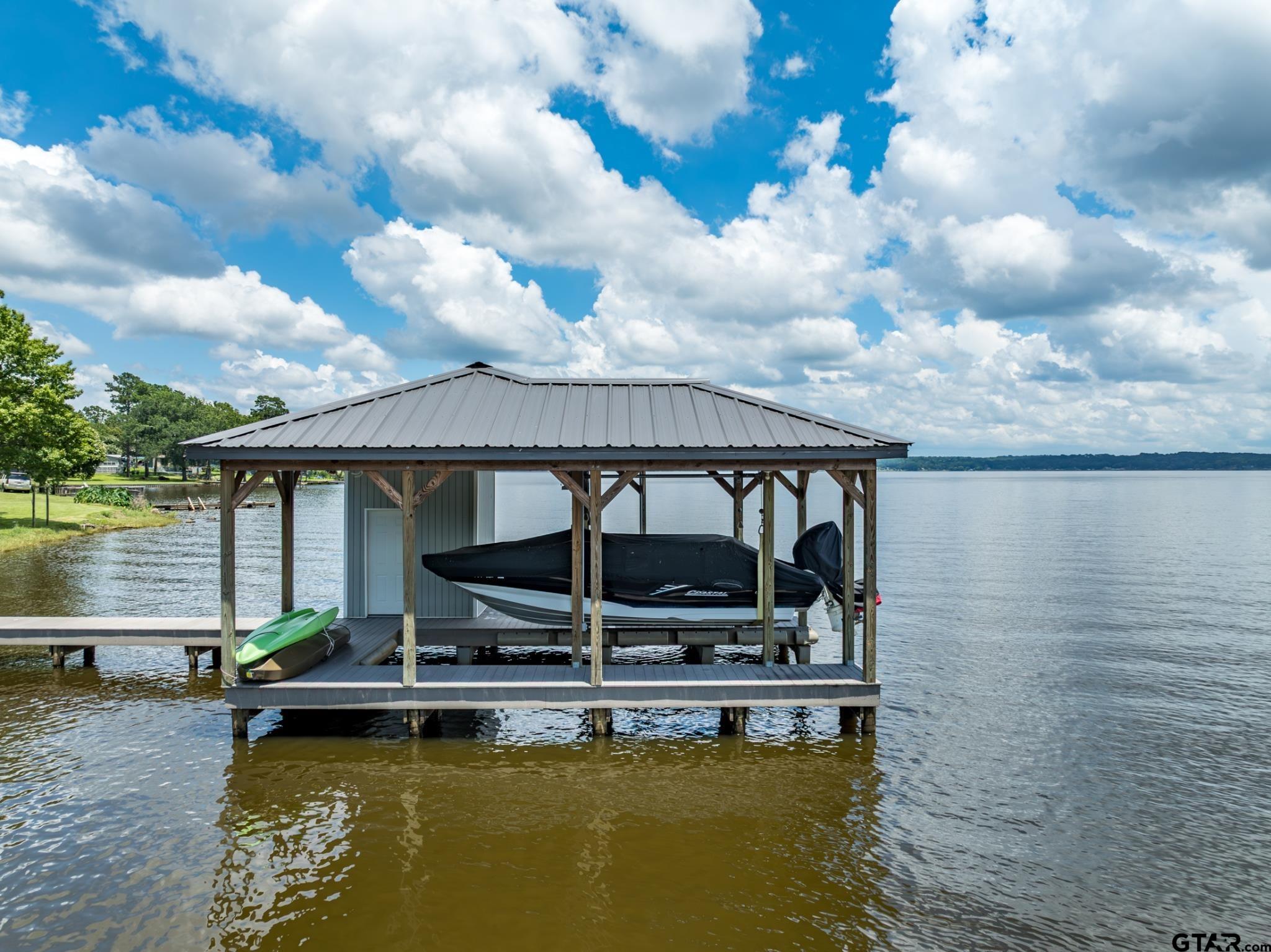 21516 Water Ridge Road Chandler, TX 75758 - Photo 33 of 48 a view of house with swimming pool and lake view