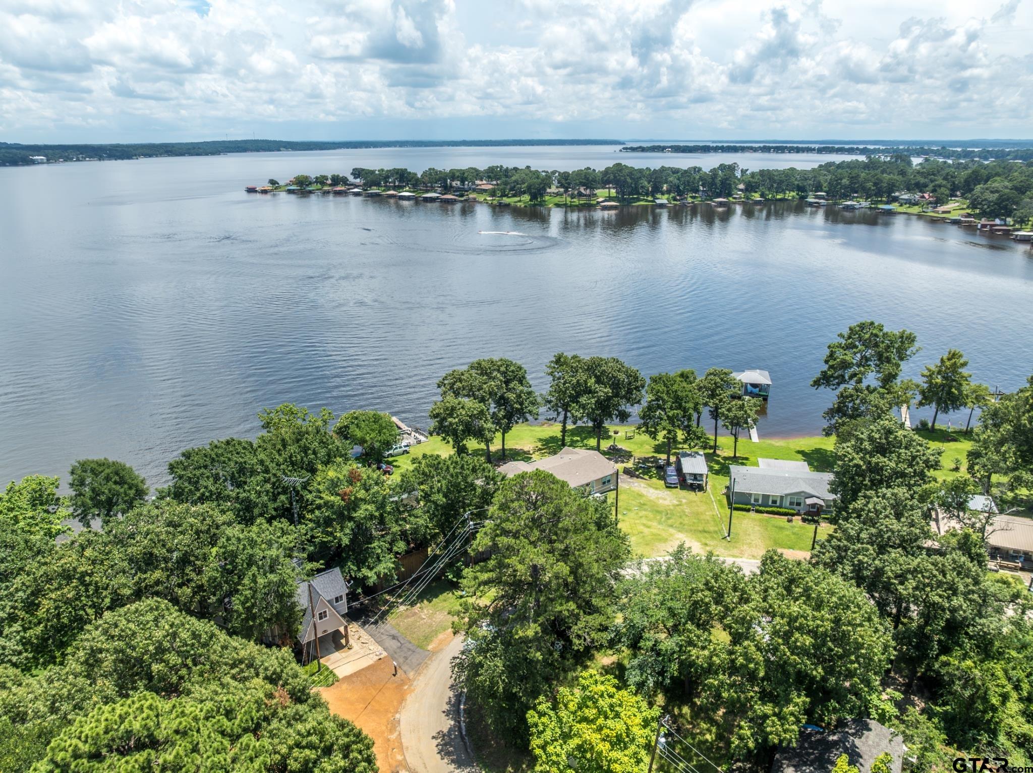 21516 Water Ridge Road Chandler, TX 75758 - Photo 46 of 48 a view of a lake with houses in front of it