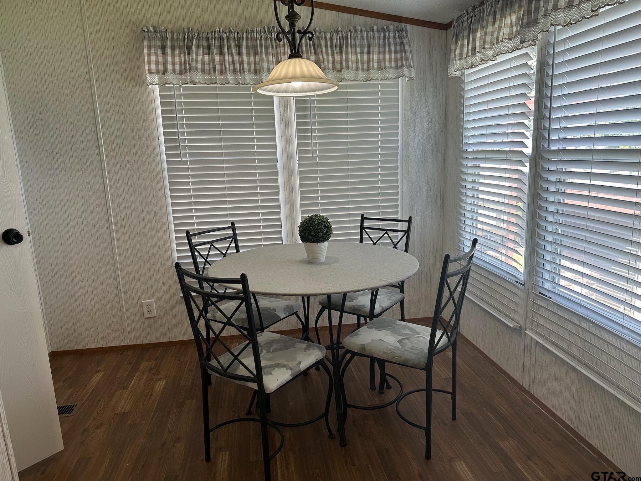 21516 Water Ridge Road Chandler, TX 75758 - Photo 9 of 48 a view of a dining room with furniture and wooden floor
