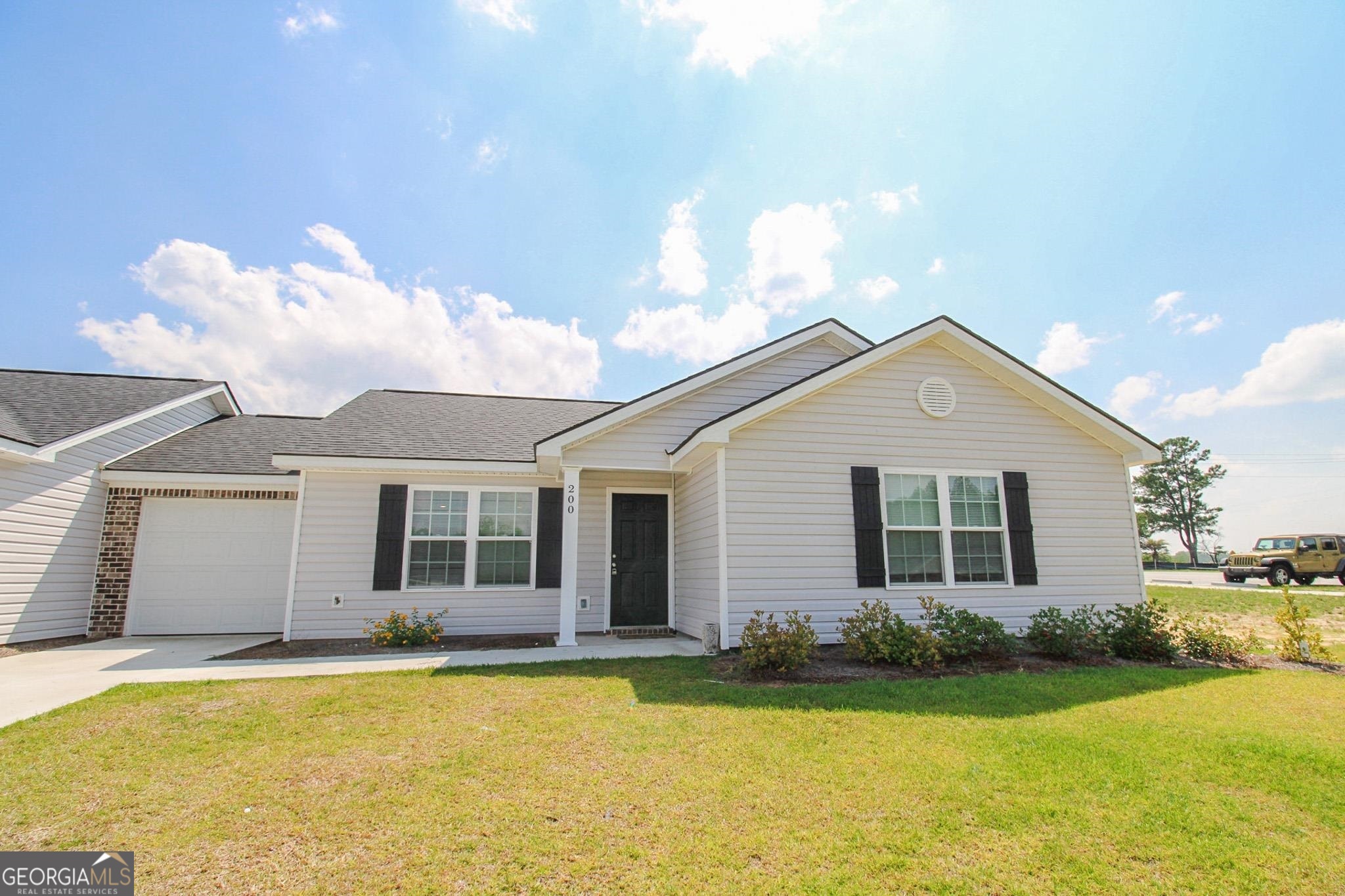 200 Evans Terrace Statesboro, GA 30458 - Photo 1 of 13 a front view of a house with garden