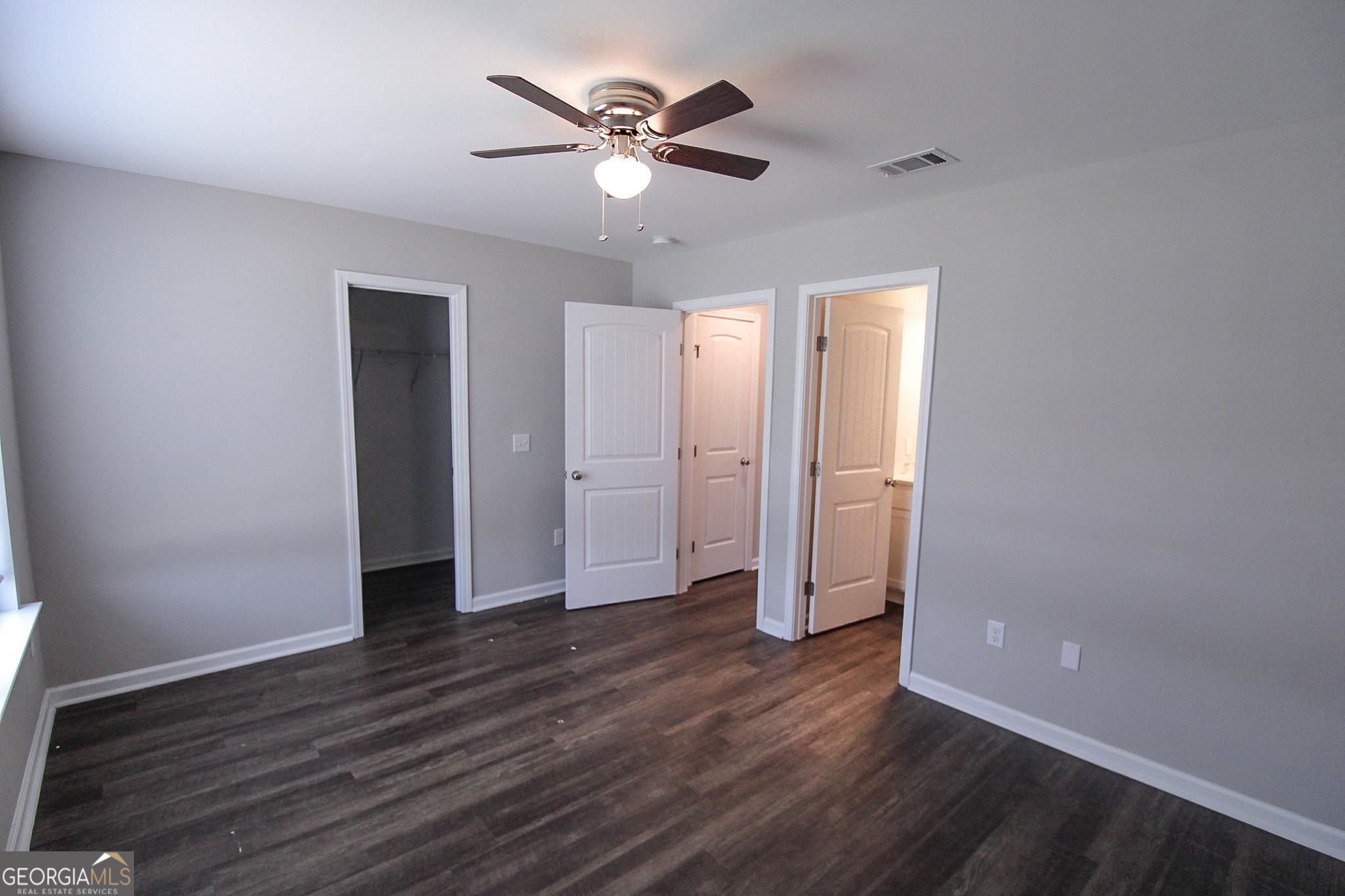 200 Evans Terrace Statesboro, GA 30458 - Photo 7 of 13 an empty room with wooden floor and ceiling fan