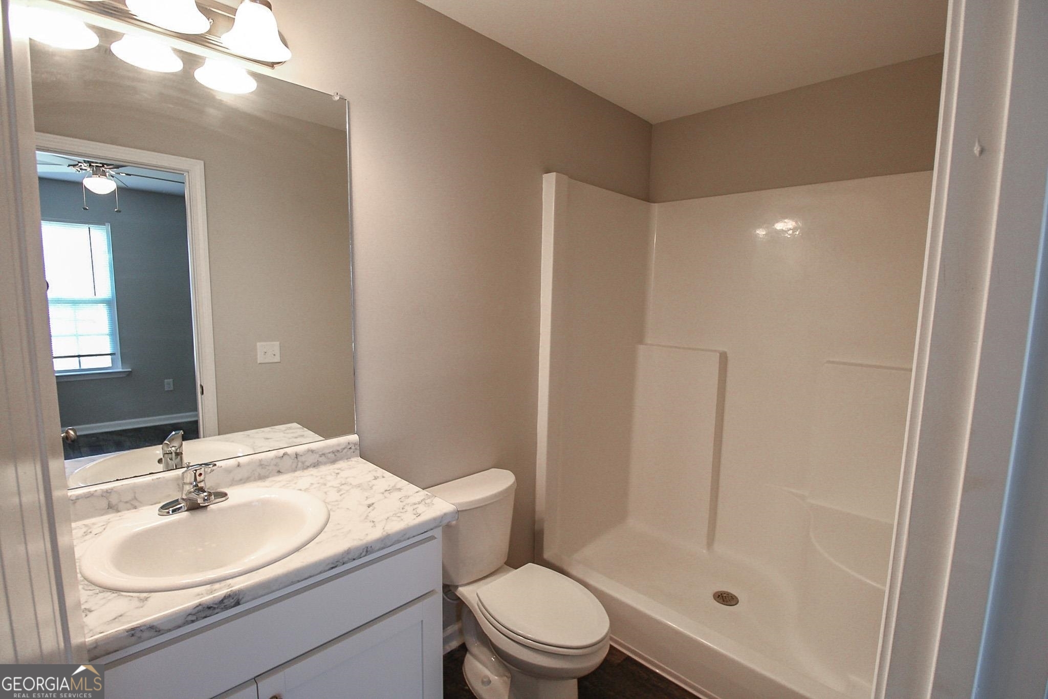 200 Evans Terrace Statesboro, GA 30458 - Photo 8 of 13 a bathroom with a sink a toilet and shower