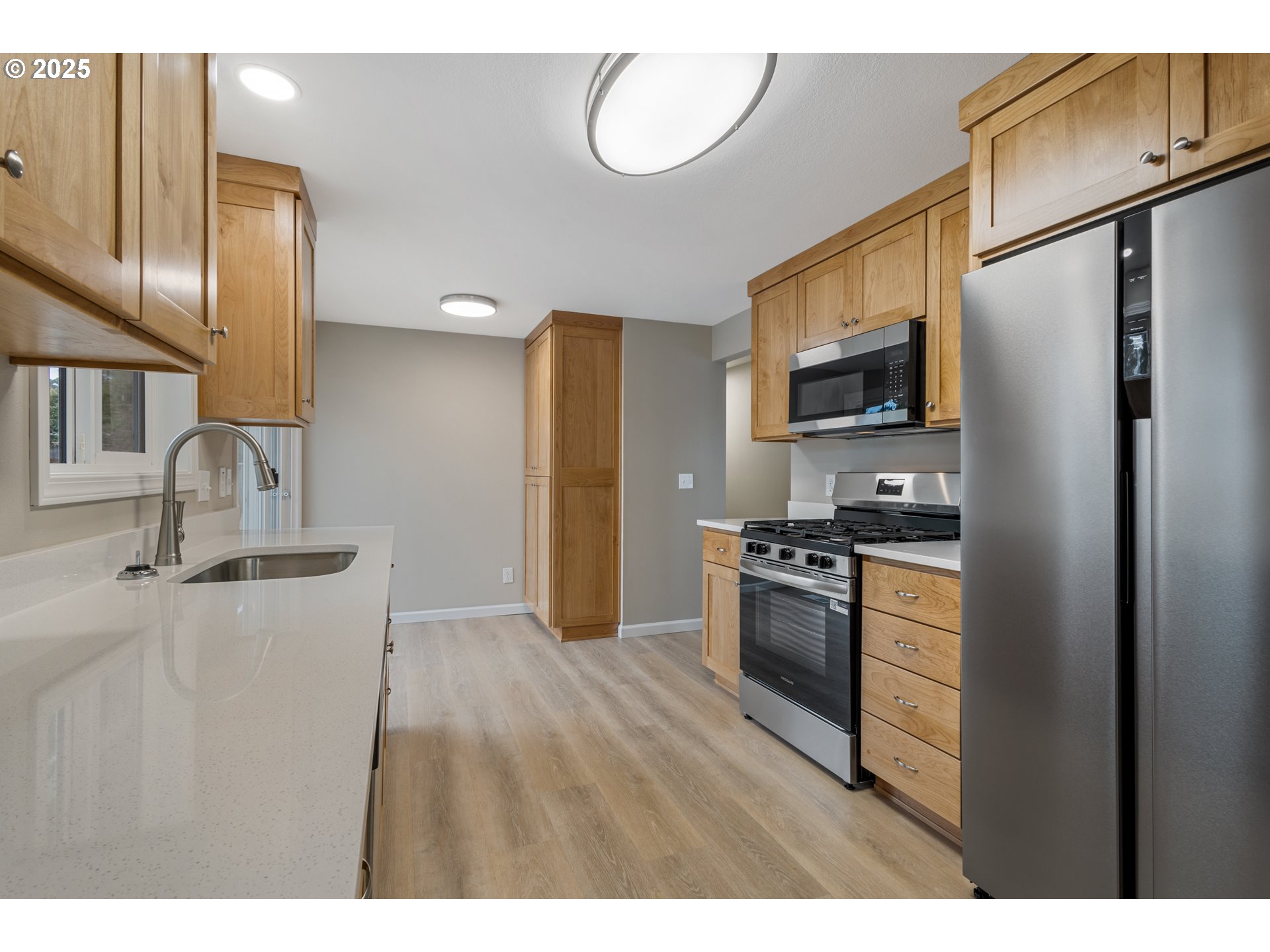 1822 Hawthorne Street Forest Grove, OR 97116 - Photo 11 of 18 a kitchen with stainless steel appliances granite countertop a refrigerator stove and sink